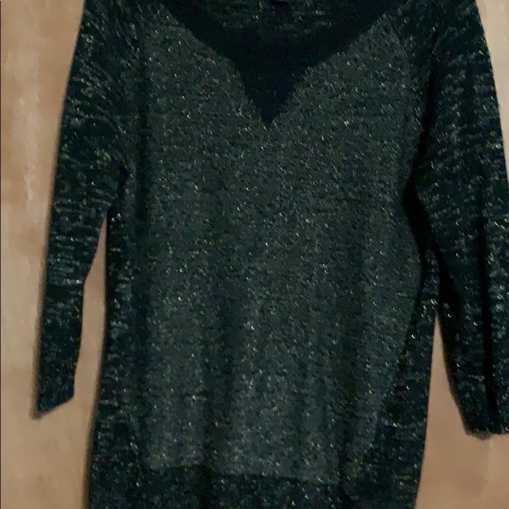 Woman’s sweater with gold through it